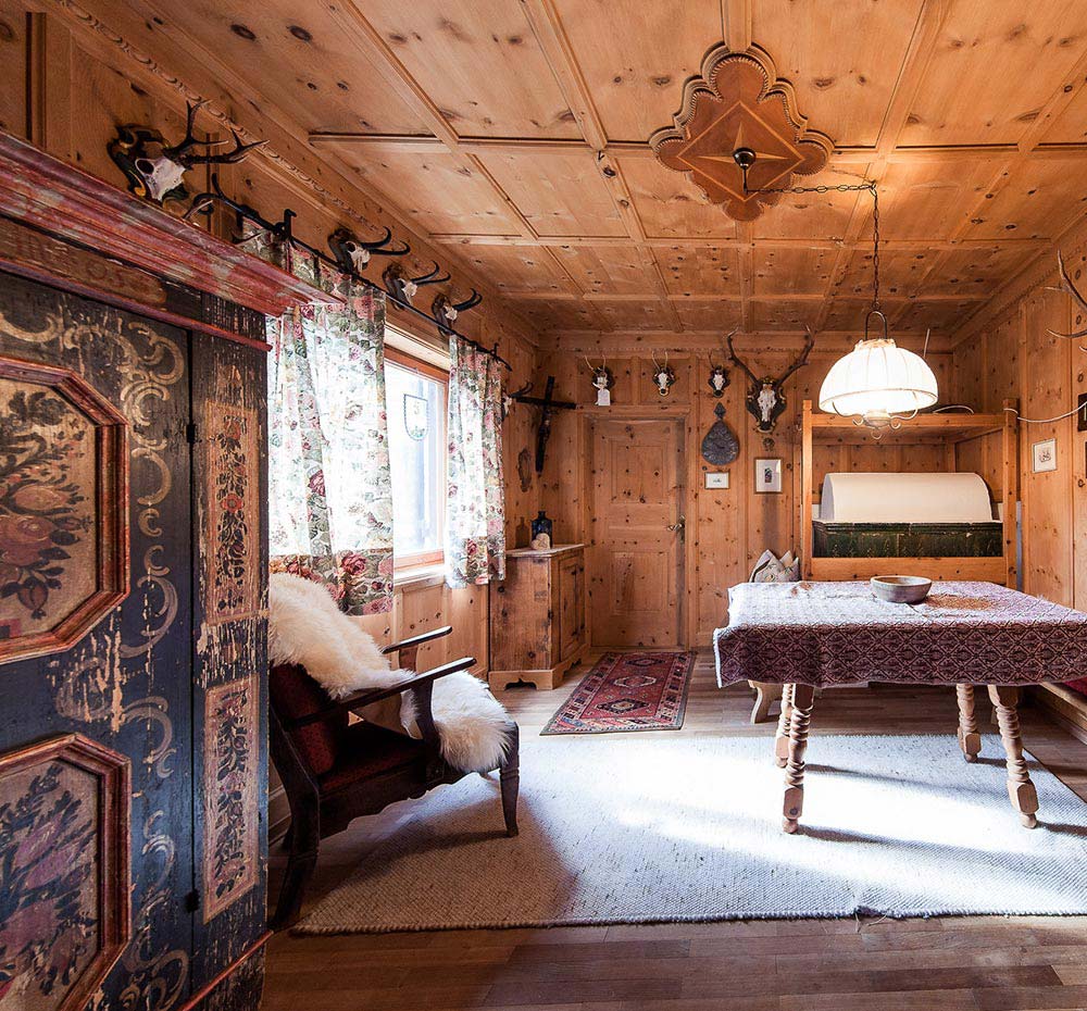 Traditional Tyrolean stube (sitting room) with cosy wood-burning stove